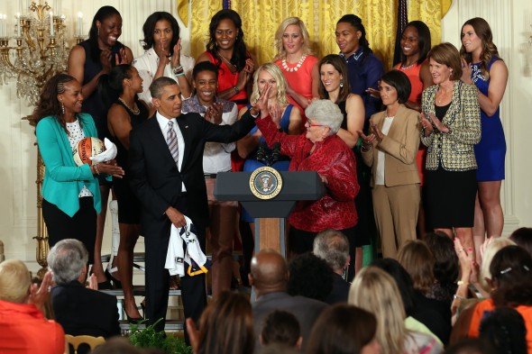 WASHINGTON, DC (June  14, 3013) -  President Barack Obama gives a high five to head coach Lin Dunn during a visit to the White House to recognize the 2012 WNBA Champions Indiana Fever. Photo: Ned Dishman/NBAE.