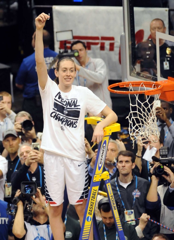 Connecticut sensation Breanna Stewart cuts the net after leading the Huskies to their fourth consecutive women's basketball national title. Stewart also took home Most Outstanding Player honors for the the fourth year in a row -- an NCAA first. Photo © Lee Michaelson.