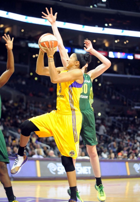 Candace Parker (Yellow, No. 3) threads the needle between Breanna Stewart (Green, No. 30) and a second Seattle defender. Parker led all scorers with 34 points, despite sitting out much of the final period. She also grabbed five rebounds, passed out four assists and grabbed three steals. Photo © Lee Michaelson, all rights reserved.