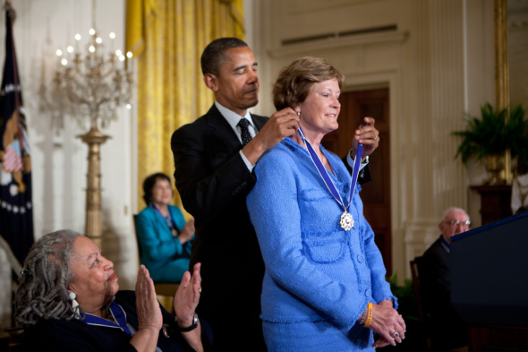 President Barack Obama presents the Presidential Medal of Freedom to former University of Tennessee basketball coach Pat Summitt during a ceremony in the East Room of the White House, May 29, 2012. Looking on at left is author Toni Morrison who also received the Medal of Freedom. (Official White House Photo by Lawrence Jackson)