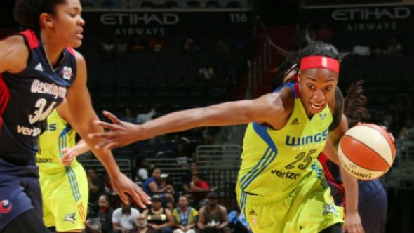 Glory Johnson drives past Krystal Thomas. Photo: NBAE/Getty Images.