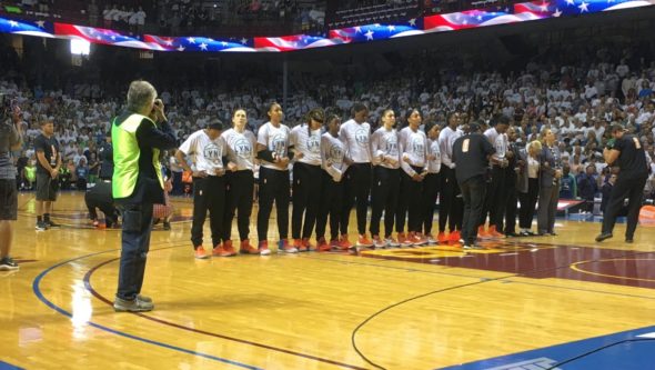 September 24, 2017 (Minneapolis) - Minnesota Lynx players stand with linked arms during national anthem before game one of the WNBA Finals. Los Angeles Sparks players decided to stay in the locker room during the anthem. Photo: © Lee Michaelson.