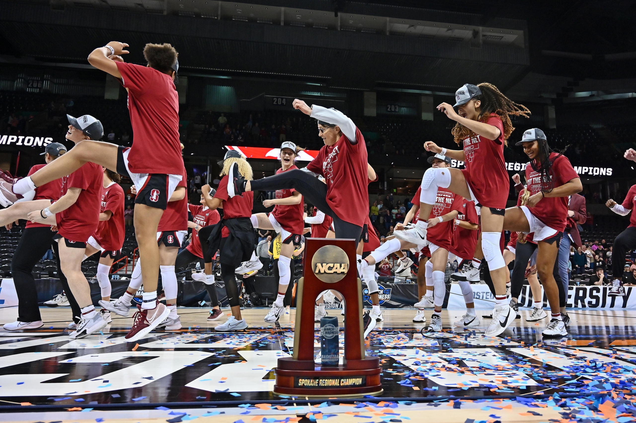 Mar 27, 2022; Spokane, WA, USA; Stanford Cardinal players and coaches dance in celebration after the game against the Texas Longhorns in the Spokane regional finals. Credit: James Snook-USA TODAY Sports