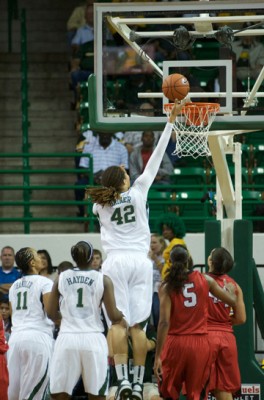 Brittney Griner (42) of Baylor finger rolls a basket against Lamar. Kimetria Hayden (1) and Mariah Chandler (11) watch.