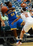 December 8, 2012 (Houston, Texas) - UCLA's Jasmine Dixon vs. Texas player . Celina Rodrigo. Photo © Robert Franklin, all rights reserved.