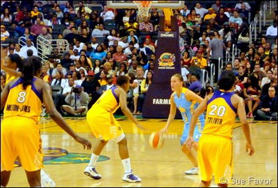 Erin Thorn prepares to pass the ball by Natasha Lacy