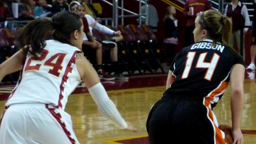 Oregon State's Ali Gibson tries to shield the ball from USC's Ashley Corral