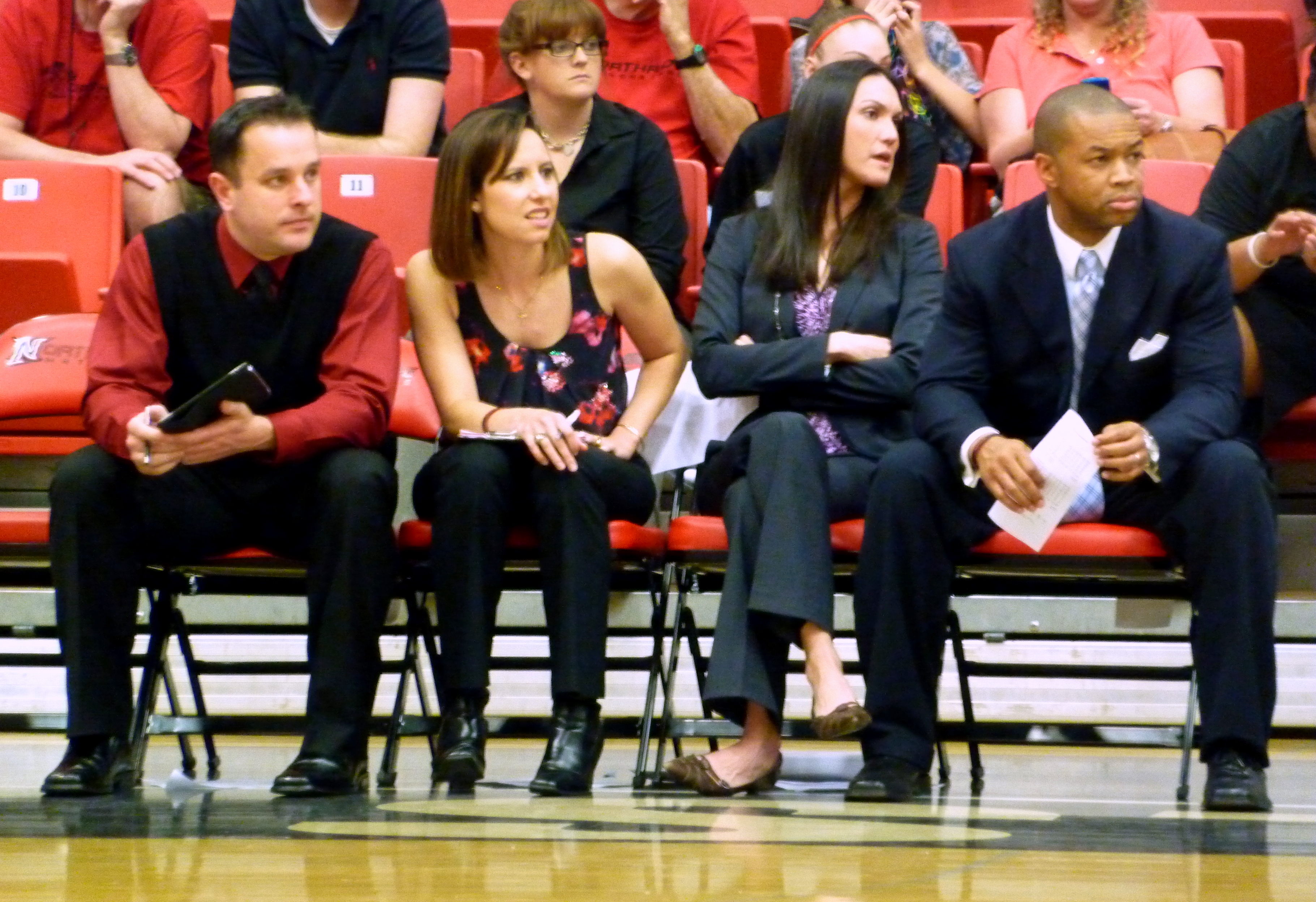 CSUN Coach Jason Flowers, far right, and his assistant coaches watch the last few moments of the game.