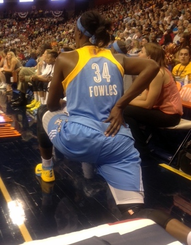 Sylvia Fowles stretching on the sideline.