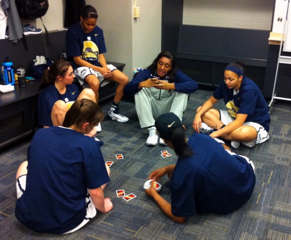 UConn players enjoying a round of UNO.