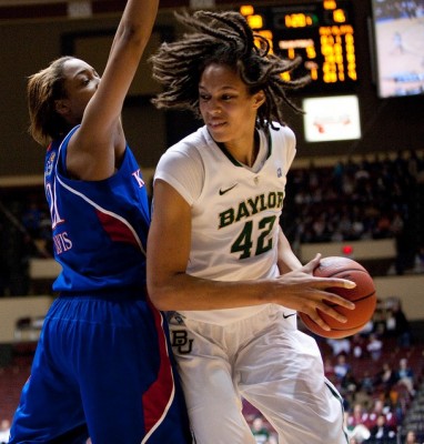 Kansas forward Carolyn Davis defends Baylor center Brittney Griner during last season's Big 12 tournament. The Lady Bears won 88-51.